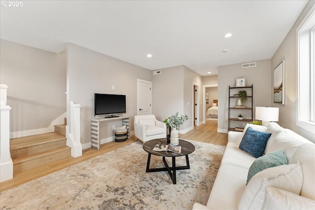 living room with light hardwood / wood-style floors