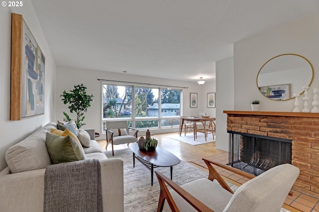 living room with light hardwood / wood-style flooring and a fireplace