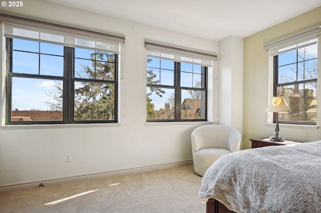 carpeted bedroom with baseboards