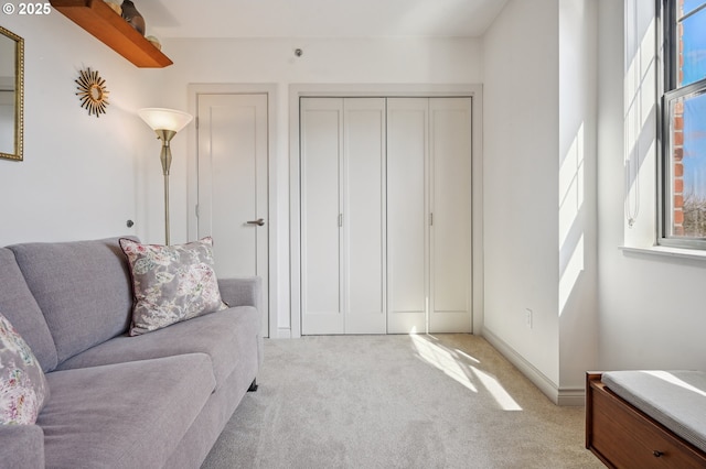 living room with light carpet and baseboards