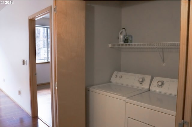 1125 NW 9th Ave, Portland, OR 97209 - laundry room featuring separate washer and dryer and light wood finished floors