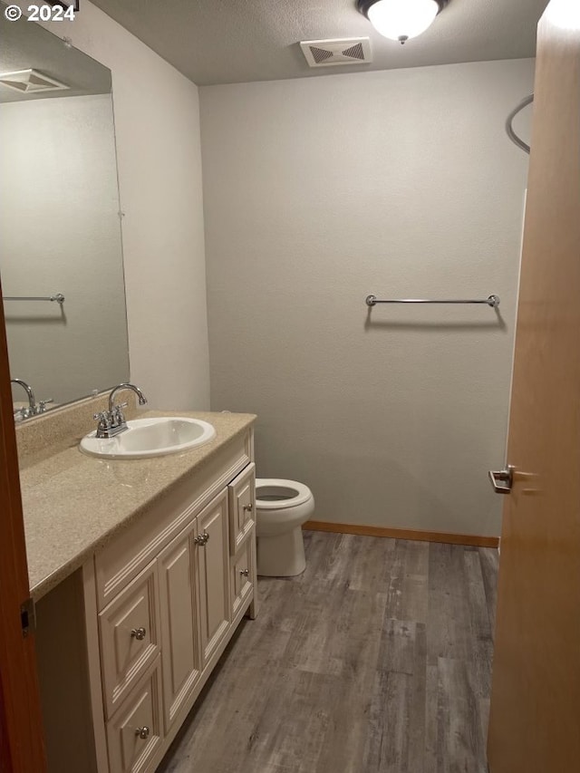 1125 NW 9th Ave, Portland, OR 97209 - bathroom featuring wood finished floors and vanity
