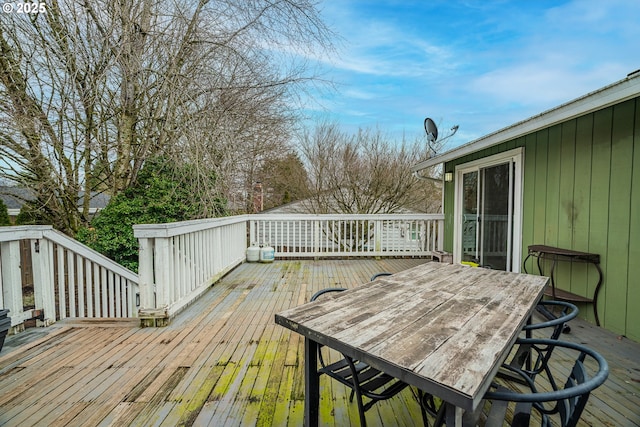 deck featuring outdoor dining area