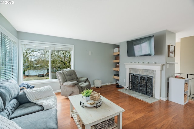 living area featuring a wealth of natural light and wood finished floors