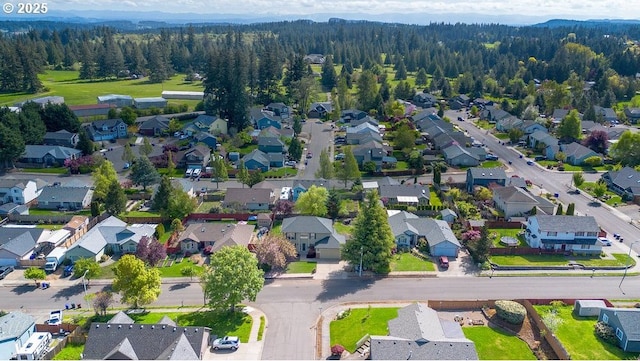 birds eye view of property with a residential view and a forest view