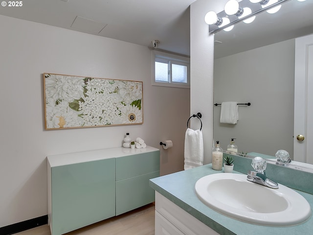 bathroom featuring vanity and wood finished floors