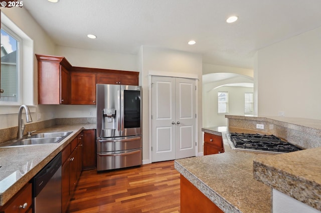 kitchen featuring dark wood-type flooring, tile countertops, recessed lighting, stainless steel appliances, and a sink