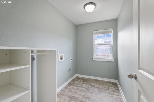 washroom with baseboards, laundry area, electric dryer hookup, washer hookup, and a textured ceiling