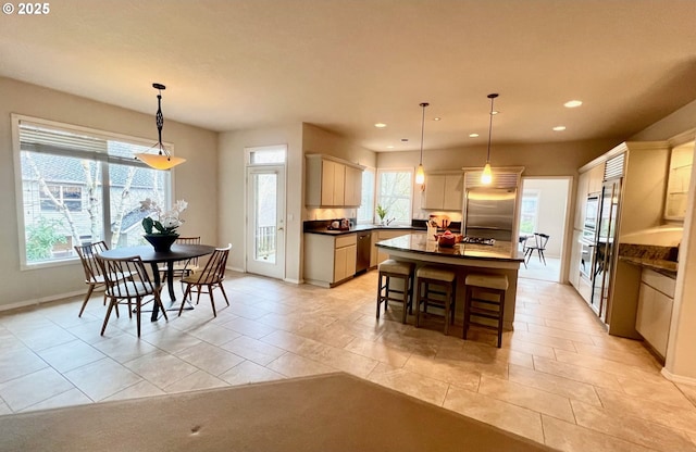 dining area featuring recessed lighting and baseboards