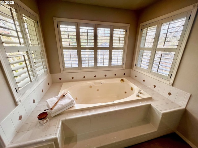 full bath featuring a tub with jets