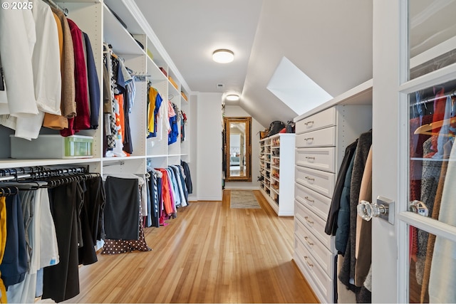 6413 Buena Vista Dr, Vancouver, WA 98661 - spacious closet featuring a skylight, light wood finished floors, and vaulted ceiling