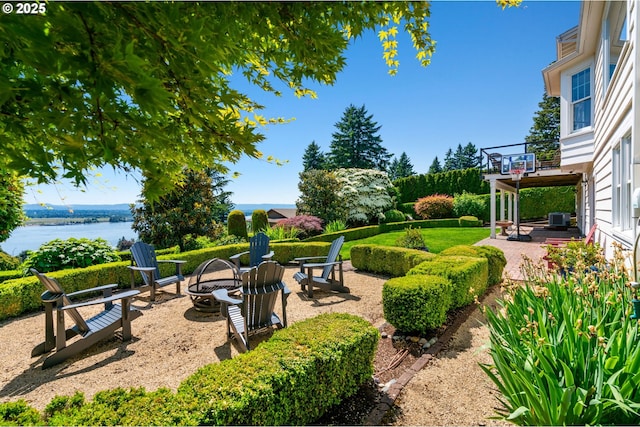 6413 Buena Vista Dr, Vancouver, WA 98661 - view of yard with an outdoor fire pit, a patio area, and a water view