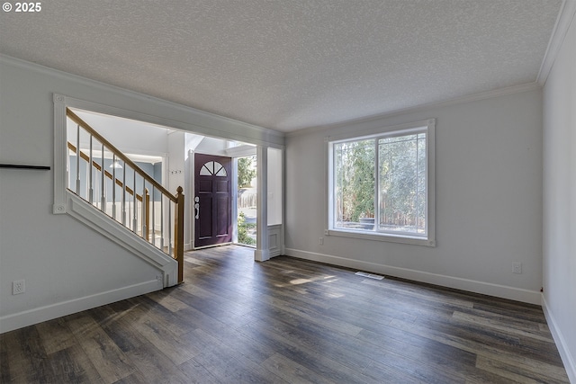 9373 SW Fast Pl, Portland, OR 97223 - entrance foyer with stairs, dark wood finished floors, a textured ceiling, and ornamental molding