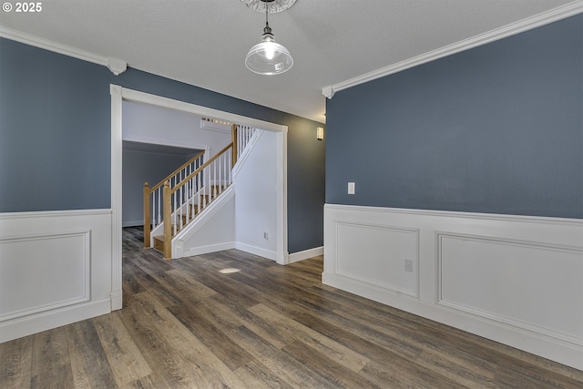 9373 SW Fast Pl, Portland, OR 97223 - empty room featuring stairs, wainscoting, crown molding, and wood finished floors
