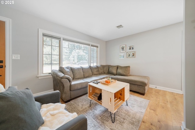 2822 NE Fremont Dr, Portland, OR 97220 - living area featuring light wood-style floors and baseboards