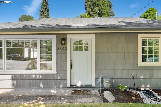 2822 NE Fremont Dr, Portland, OR 97220 - doorway to property featuring roof with shingles
