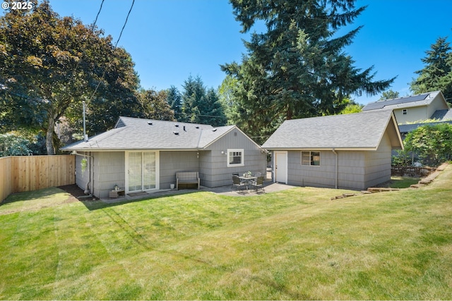 2822 NE Fremont Dr, Portland, OR 97220 - rear view of property featuring a patio area, roof with shingles, and an outbuilding