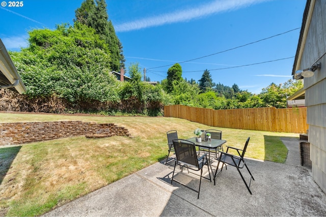 2822 NE Fremont Dr, Portland, OR 97220 - fenced backyard with a patio and outdoor dining space
