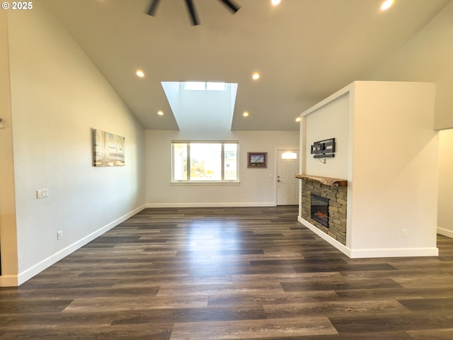 unfurnished living room with high vaulted ceiling, recessed lighting, a fireplace, baseboards, and dark wood-style floors