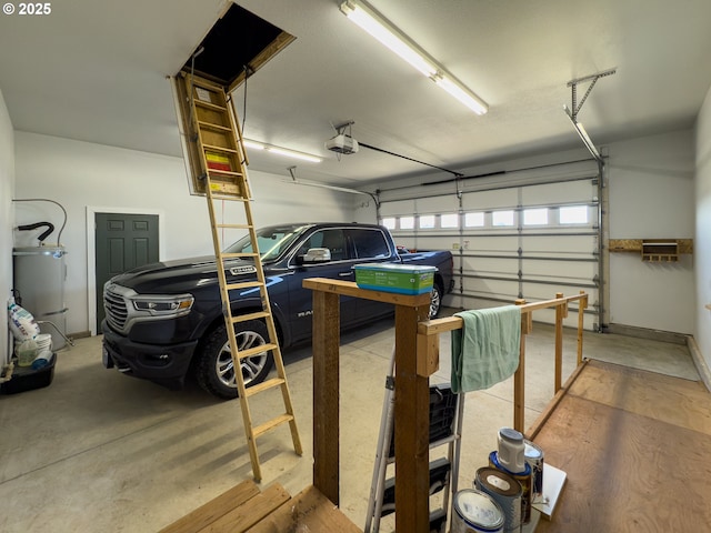 garage with secured water heater and a garage door opener