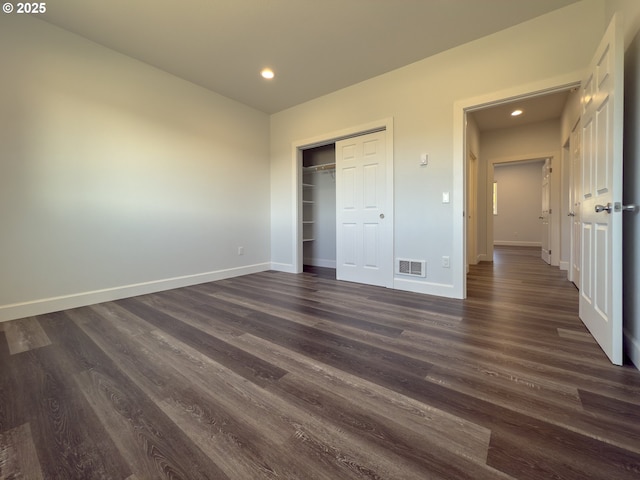 unfurnished bedroom featuring recessed lighting, dark wood finished floors, visible vents, and baseboards