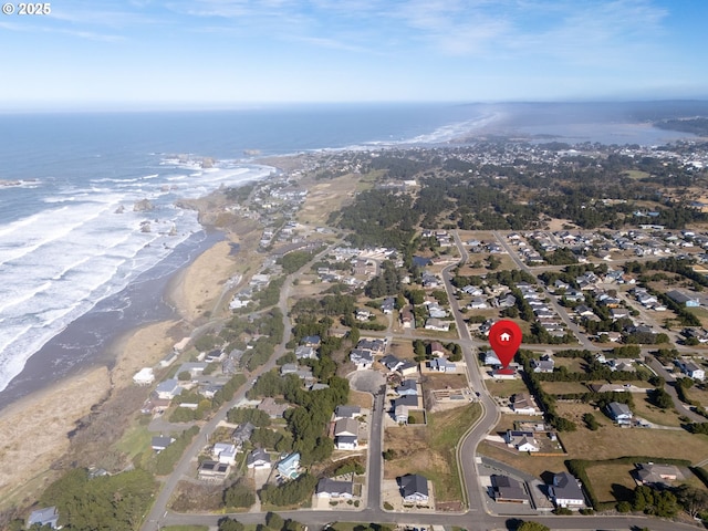 aerial view with a water view and a view of the beach