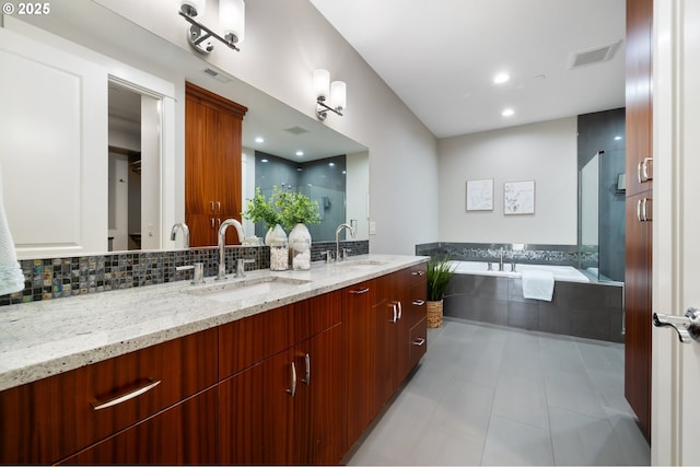 full bathroom featuring tasteful backsplash, visible vents, a sink, and double vanity