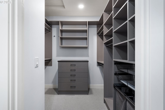 walk in closet with carpet