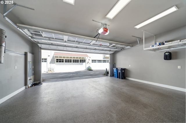 garage with baseboards and a garage door opener