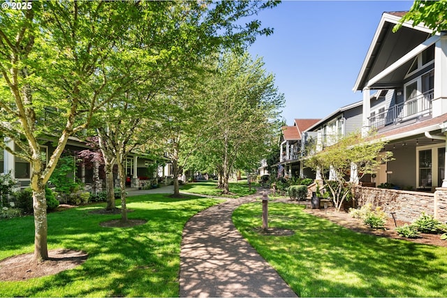 view of property's community featuring a yard