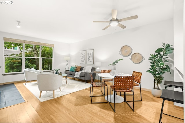 1710 S Harbor Way Unit 201, Portland, OR 97201 - dining area featuring light wood-style flooring, a ceiling fan, and baseboards