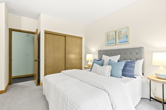 1710 S Harbor Way Unit 201, Portland, OR 97201 - bedroom featuring light colored carpet, a closet, and baseboards