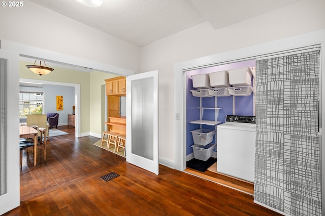 4536 N Haight Ave, Portland, OR 97217 - interior space featuring baseboards, washer / dryer, visible vents, and hardwood / wood-style floors