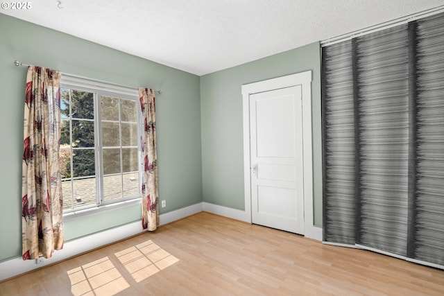 4536 N Haight Ave, Portland, OR 97217 - spare room with baseboards and wood finished floors