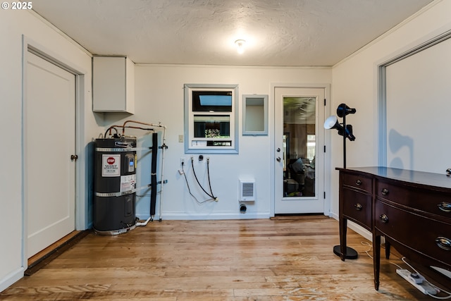 1327 Grant St, Eugene, OR 97402 - utility room with strapped water heater and heating unit