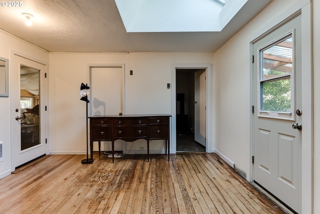 1327 Grant St, Eugene, OR 97402 - entrance foyer with a skylight, hardwood / wood-style flooring, and baseboards