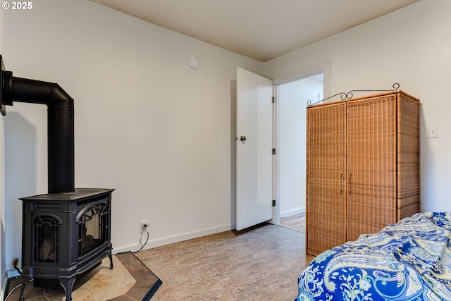 1327 Grant St, Eugene, OR 97402 - bedroom with a wood stove and baseboards