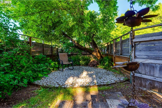 1327 Grant St, Eugene, OR 97402 - fenced backyard featuring a patio area