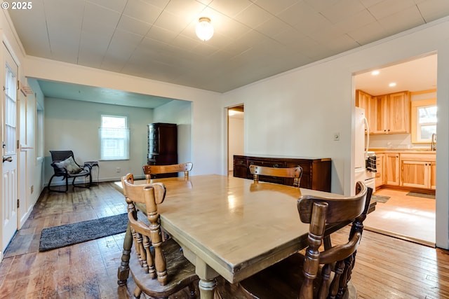 1327 Grant St, Eugene, OR 97402 - dining area with light wood-style floors and ornamental molding