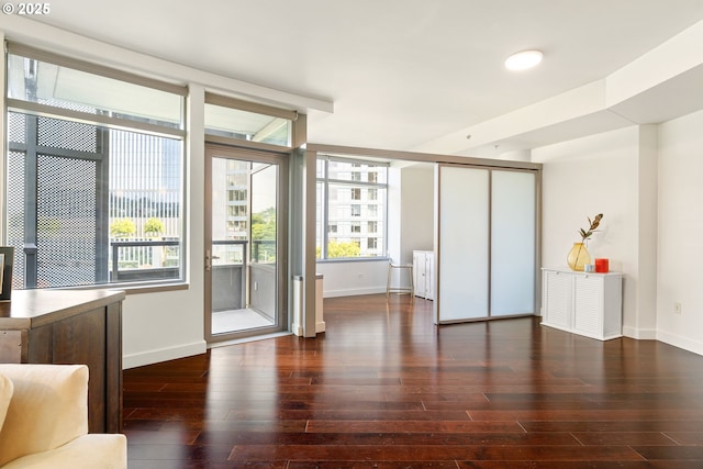 3601 S River Pkwy Unit 800, Portland, OR 97239 - unfurnished living room with baseboards and hardwood / wood-style floors