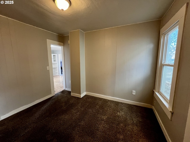 312 NW 7th St, Pendleton, OR 97801 - spare room featuring dark colored carpet and baseboards