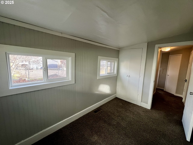312 NW 7th St, Pendleton, OR 97801 - unfurnished bedroom featuring dark colored carpet and vaulted ceiling