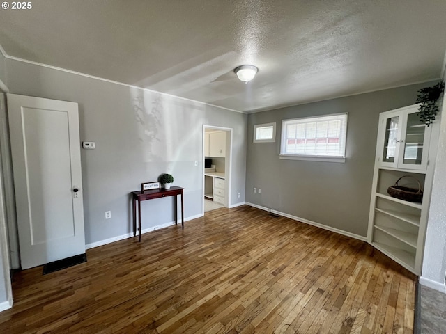 312 NW 7th St, Pendleton, OR 97801 - unfurnished living room with hardwood / wood-style flooring and a textured ceiling