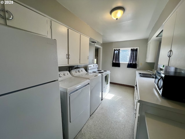 312 NW 7th St, Pendleton, OR 97801 - washroom featuring washer and dryer and baseboards