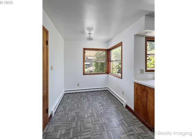 5730 N Harvard St, Portland, OR 97203 - unfurnished dining area with baseboards and a baseboard radiator