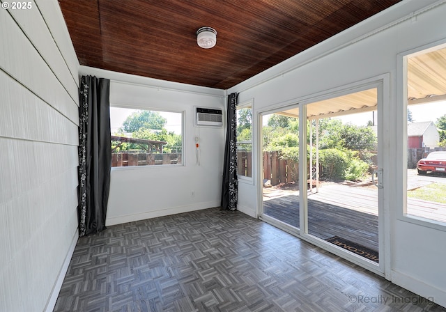 5730 N Harvard St, Portland, OR 97203 - unfurnished room with healthy amount of natural light, baseboards, a wall mounted air conditioner, and wood ceiling