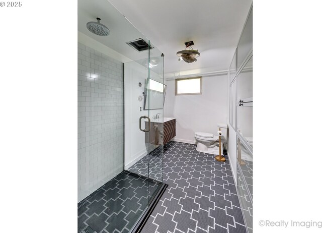 5730 N Harvard St, Portland, OR 97203 - full bathroom with a stall shower, toilet, and baseboards