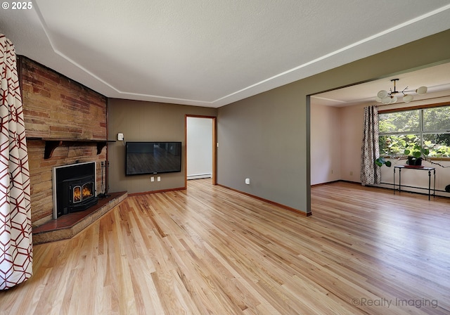 5730 N Harvard St, Portland, OR 97203 - unfurnished living room with wood finished floors, baseboard heating, and a chandelier