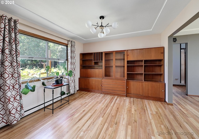 5730 N Harvard St, Portland, OR 97203 - dining area featuring a chandelier, light wood-type flooring, and a baseboard radiator