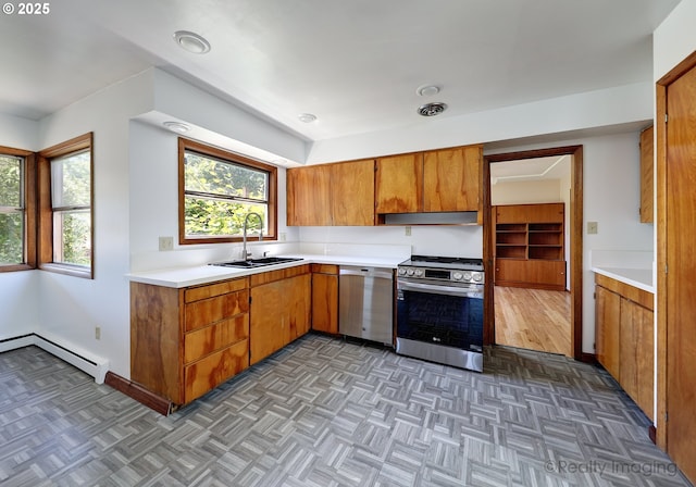 5730 N Harvard St, Portland, OR 97203 - kitchen featuring appliances with stainless steel finishes, a baseboard radiator, a sink, light countertops, and brown cabinets
